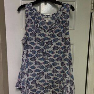 Sleeveless  Blouse with Blue and pink fish on it.